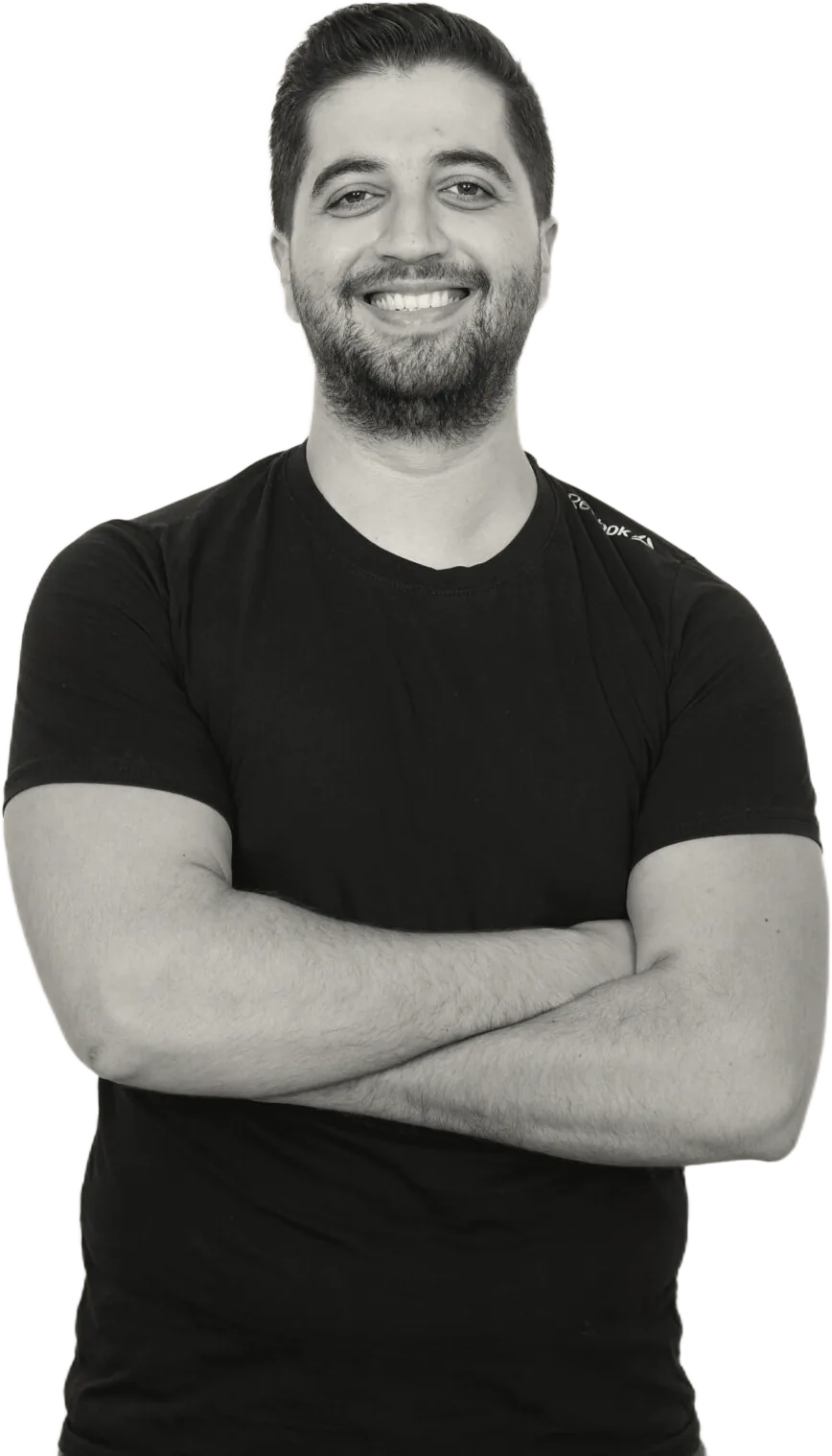 Sergio Aoun, arms crossed, smiling